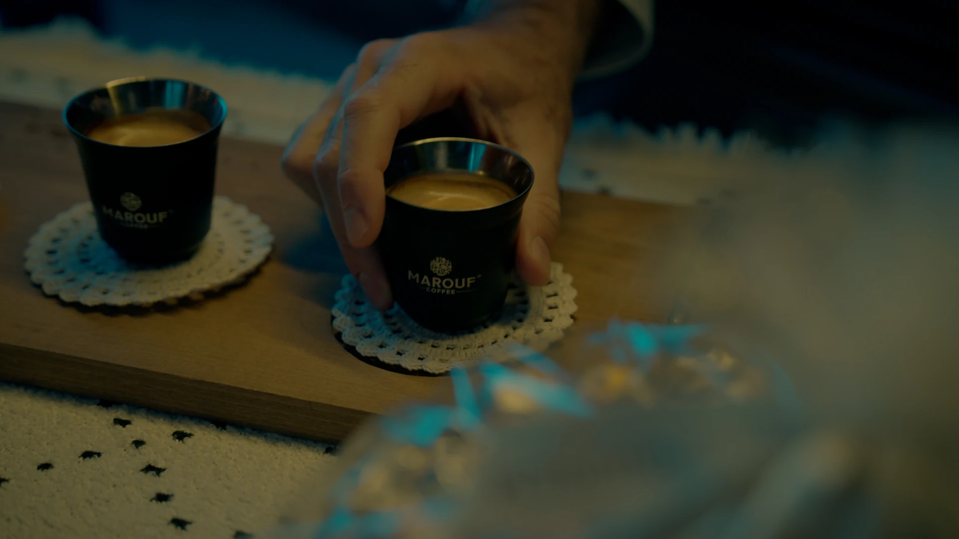 Coffee passed between hands in the Marouf commercial